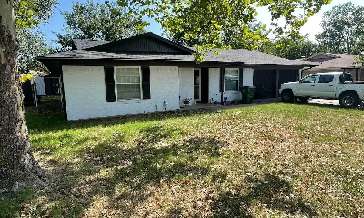 Professional roofing crew working on a residential roof in Wellington